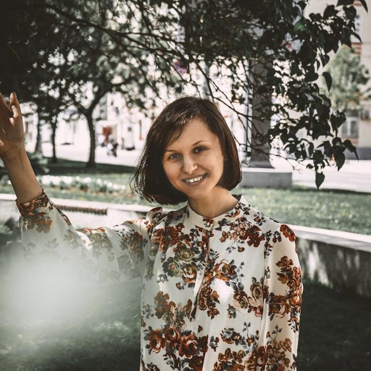 Kaveri Mehta, Lead Design Curator at Adaptive Lifestyle Path, reviewing corporate floral arrangements